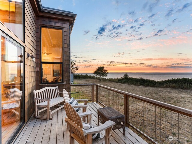 deck at dusk with a water view