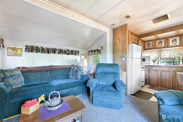 living room featuring lofted ceiling and light colored carpet