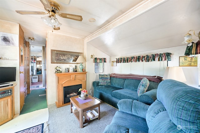 carpeted living room featuring ceiling fan and lofted ceiling