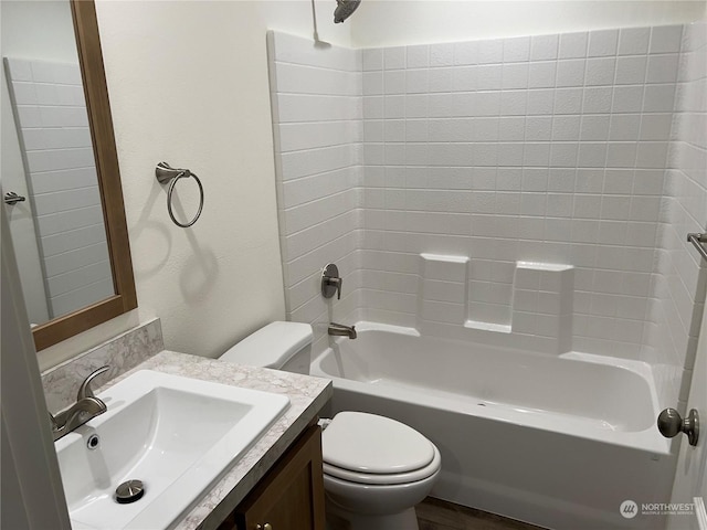 full bathroom featuring vanity, shower / washtub combination, and toilet