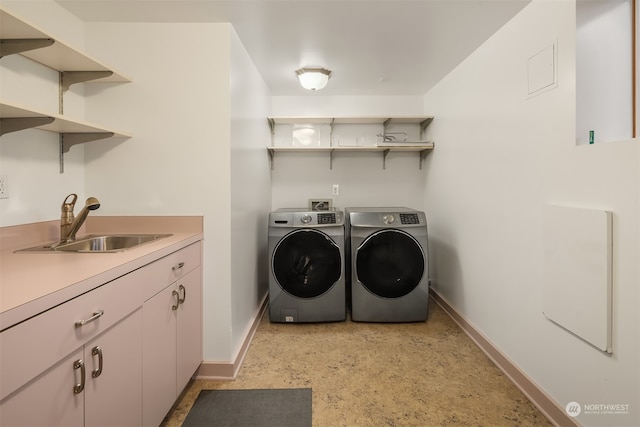 laundry area with sink and washing machine and dryer