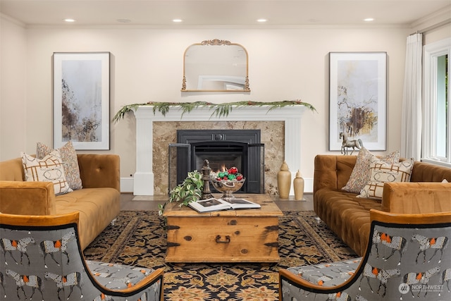 sitting room with hardwood / wood-style flooring, a high end fireplace, and ornamental molding