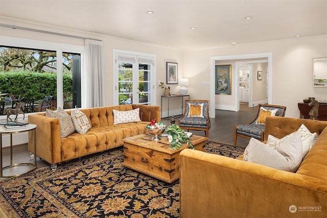 living room with ornamental molding, dark hardwood / wood-style floors, and french doors