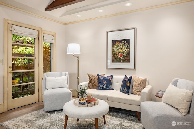 living room featuring hardwood / wood-style floors and vaulted ceiling with beams