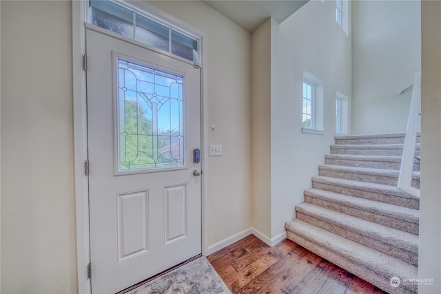 entryway with wood-type flooring