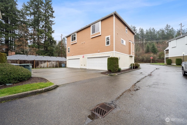 view of side of property with a garage