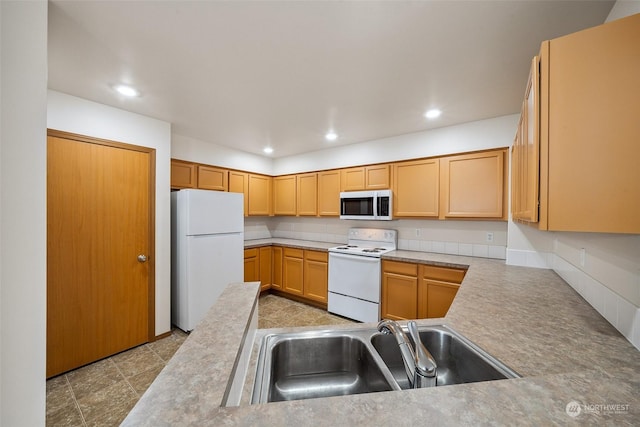 kitchen with white appliances and sink