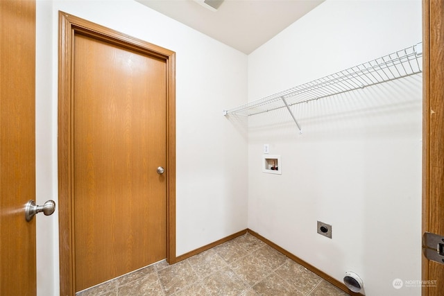 clothes washing area with washer hookup and hookup for an electric dryer