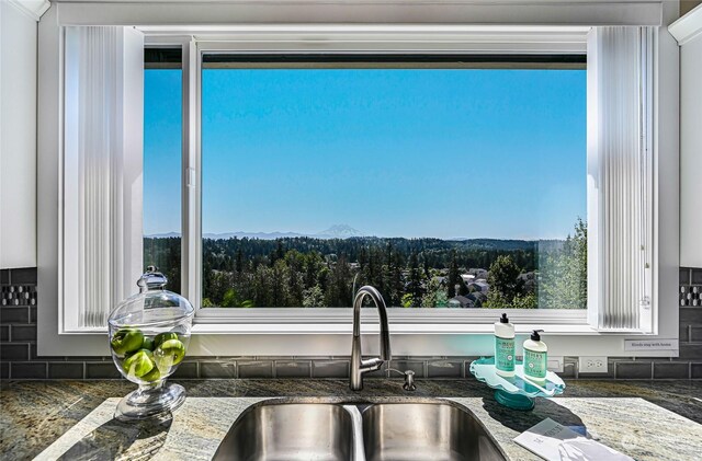 kitchen with a mountain view and sink