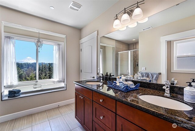 bathroom with independent shower and bath, tile patterned floors, a mountain view, and dual bowl vanity