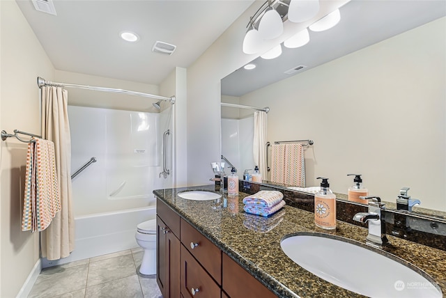 full bathroom with double vanity, shower / bath combo with shower curtain, tile patterned flooring, and toilet