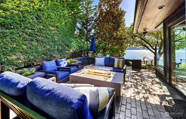 view of patio with an outdoor hangout area and a water view