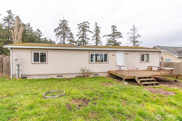 back of house with a yard, crawl space, fence, and a wooden deck