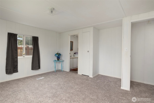 empty room with carpet flooring