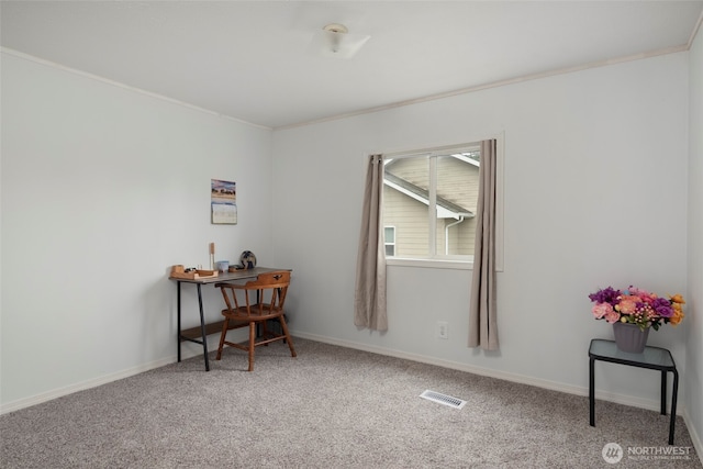 office with baseboards, crown molding, visible vents, and carpet flooring