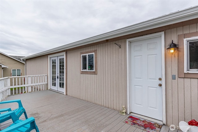 wooden deck featuring french doors