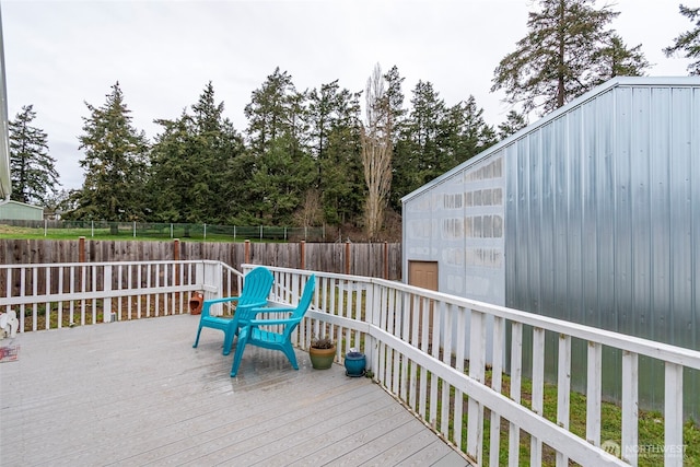 wooden terrace featuring fence