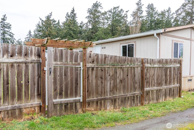 view of gate featuring fence