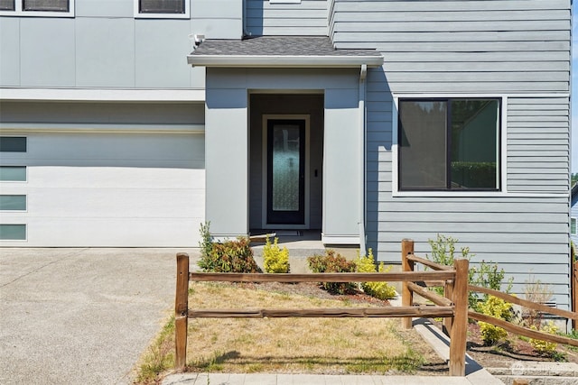 doorway to property with a garage