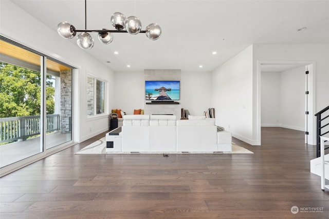 interior space featuring hardwood / wood-style flooring, a notable chandelier, and hanging light fixtures