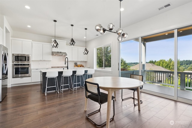 dining area with dark wood-type flooring