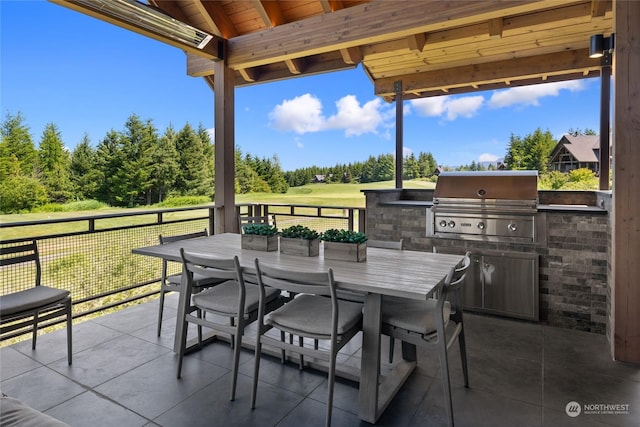 view of patio / terrace with area for grilling and a grill