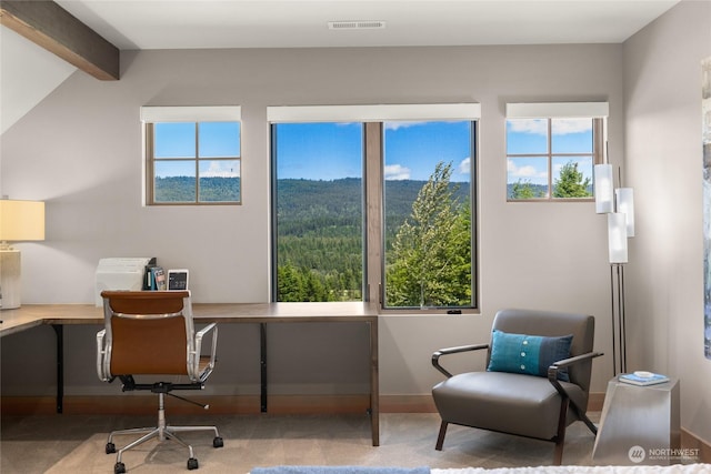 office space with vaulted ceiling with beams