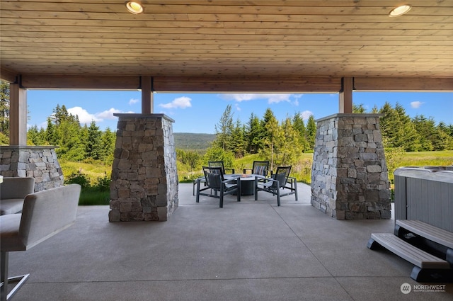 view of patio / terrace with a fire pit