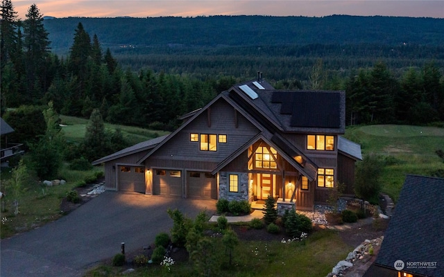 view of front facade with a garage and a mountain view