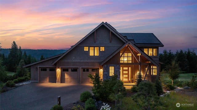 view of front of house with solar panels