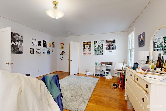 bedroom featuring light wood-style flooring