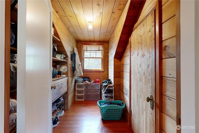 walk in closet with wood finished floors