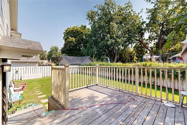 deck featuring a fenced backyard and a yard