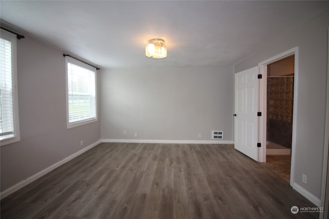 empty room featuring dark hardwood / wood-style floors