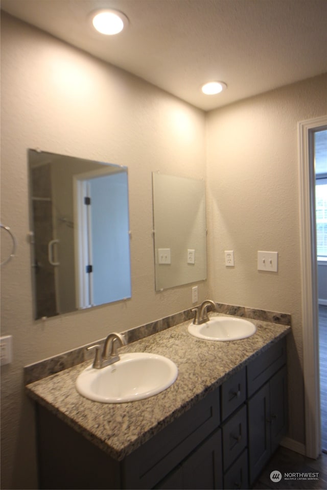 bathroom featuring dual vanity