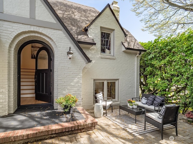 exterior space featuring an outdoor living space and a patio area