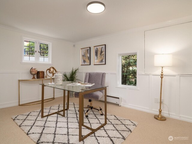 home office featuring a wealth of natural light, light colored carpet, and crown molding