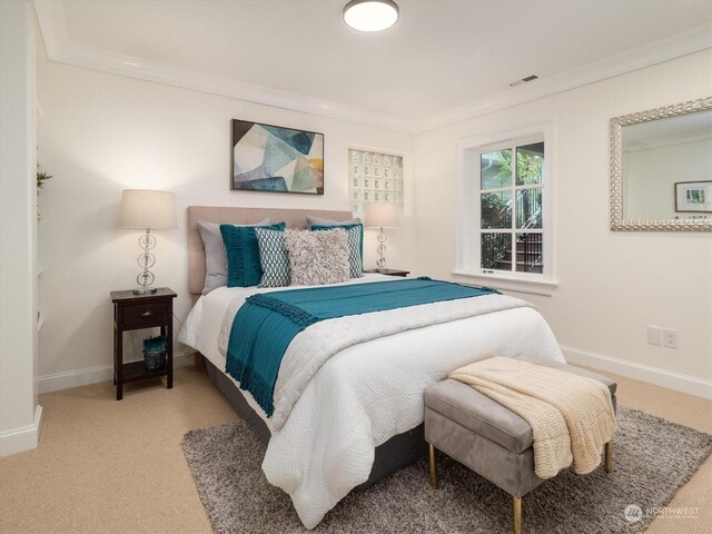 bedroom with light carpet and ornamental molding