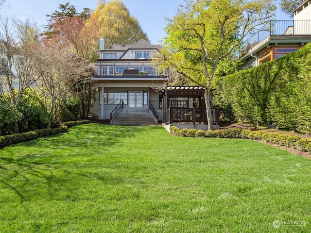 exterior space featuring a pergola and a front lawn