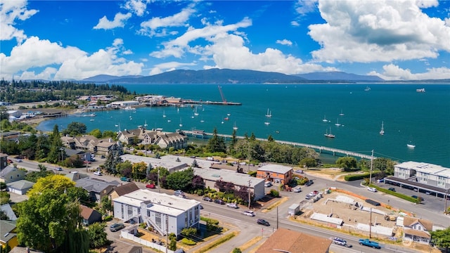 birds eye view of property featuring a water and mountain view