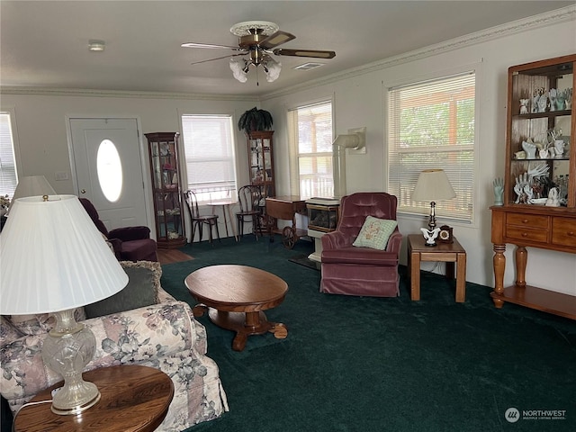 living room featuring ornamental molding, carpet flooring, and ceiling fan