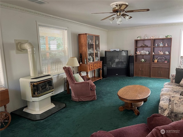 living room featuring crown molding, a wood stove, and dark colored carpet