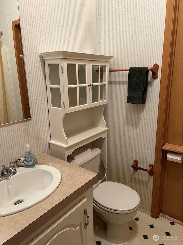 bathroom with vanity and toilet