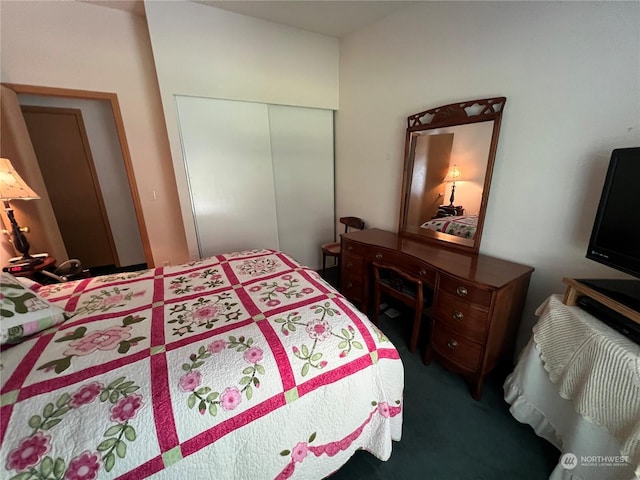 carpeted bedroom with a closet