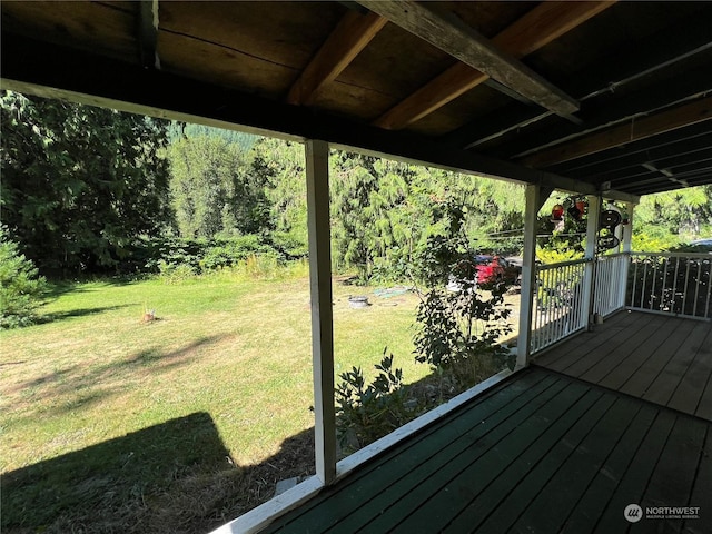 wooden deck with a yard