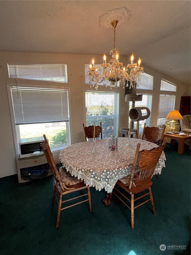 dining room with vaulted ceiling, carpet flooring, a notable chandelier, and a textured ceiling