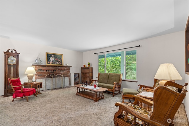 carpeted living room with a brick fireplace