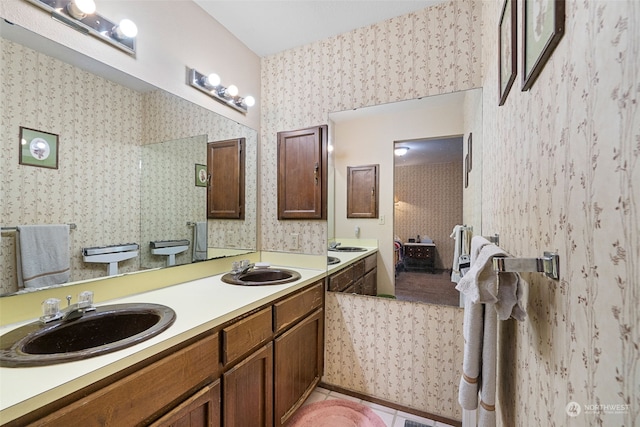 bathroom with tile patterned floors, vanity, and toilet