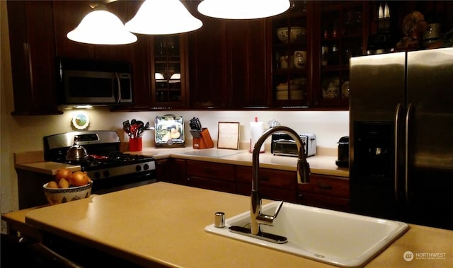 kitchen featuring appliances with stainless steel finishes and sink