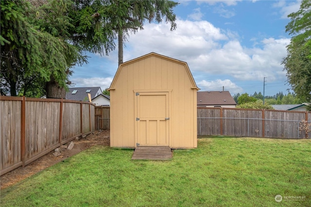 view of outbuilding featuring a yard